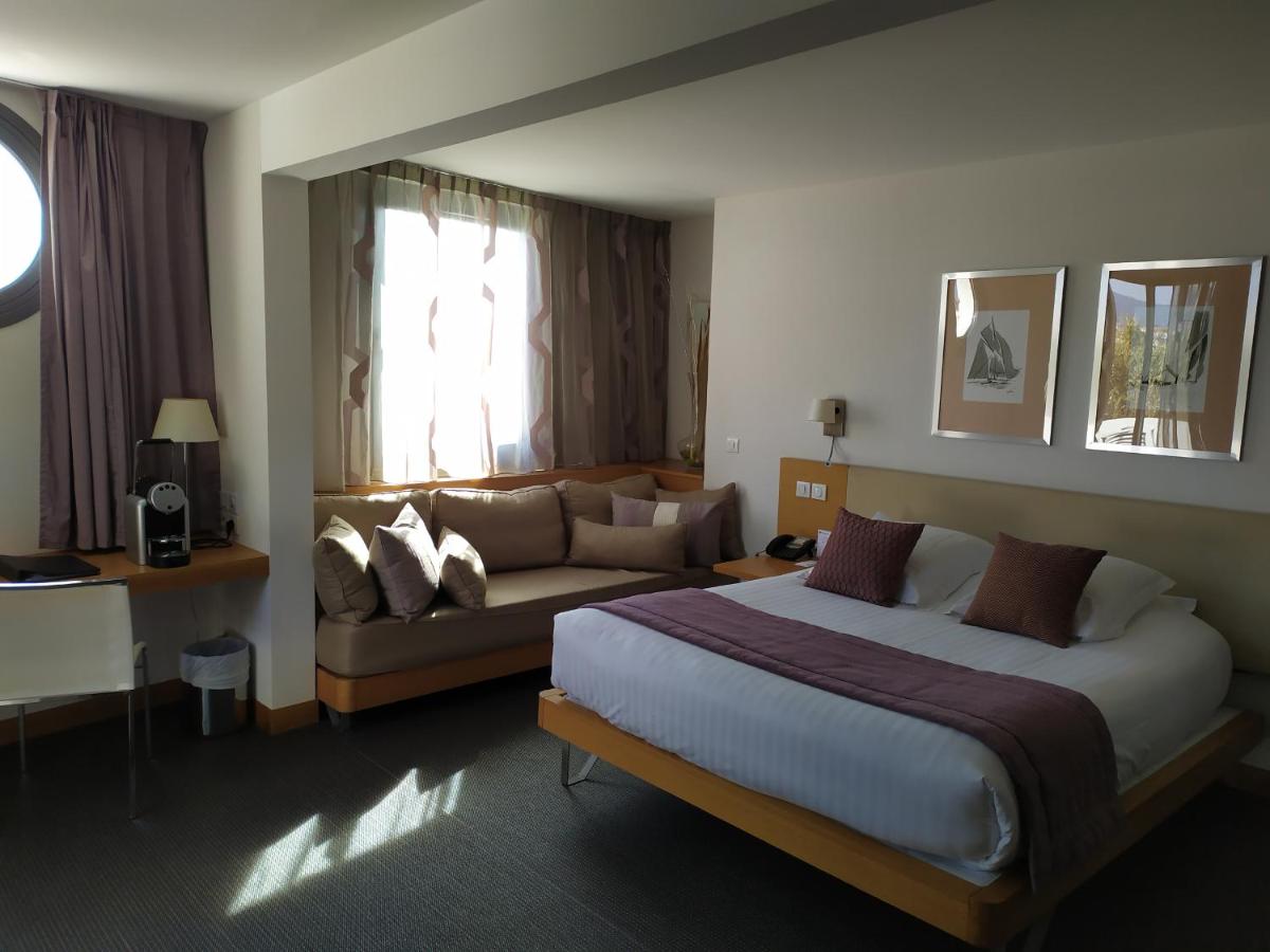 Un ou plusieurs lits dans un hébergement de l'établissement Best Western Premier Hôtel du Vieux-Port