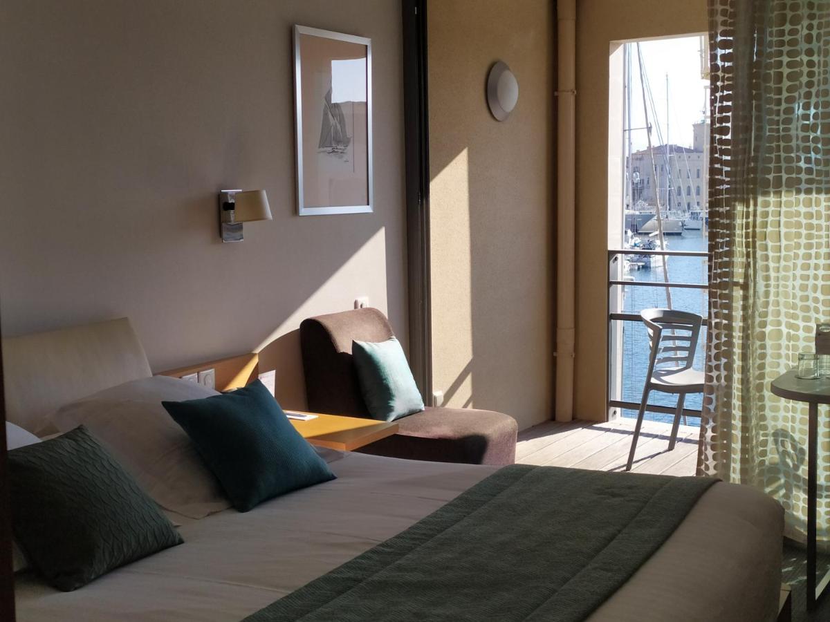 Un ou plusieurs lits dans un hébergement de l'établissement Best Western Premier Hôtel du Vieux-Port