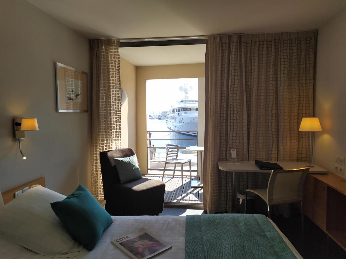 Un ou plusieurs lits dans un hébergement de l'établissement Best Western Premier Hôtel du Vieux-Port