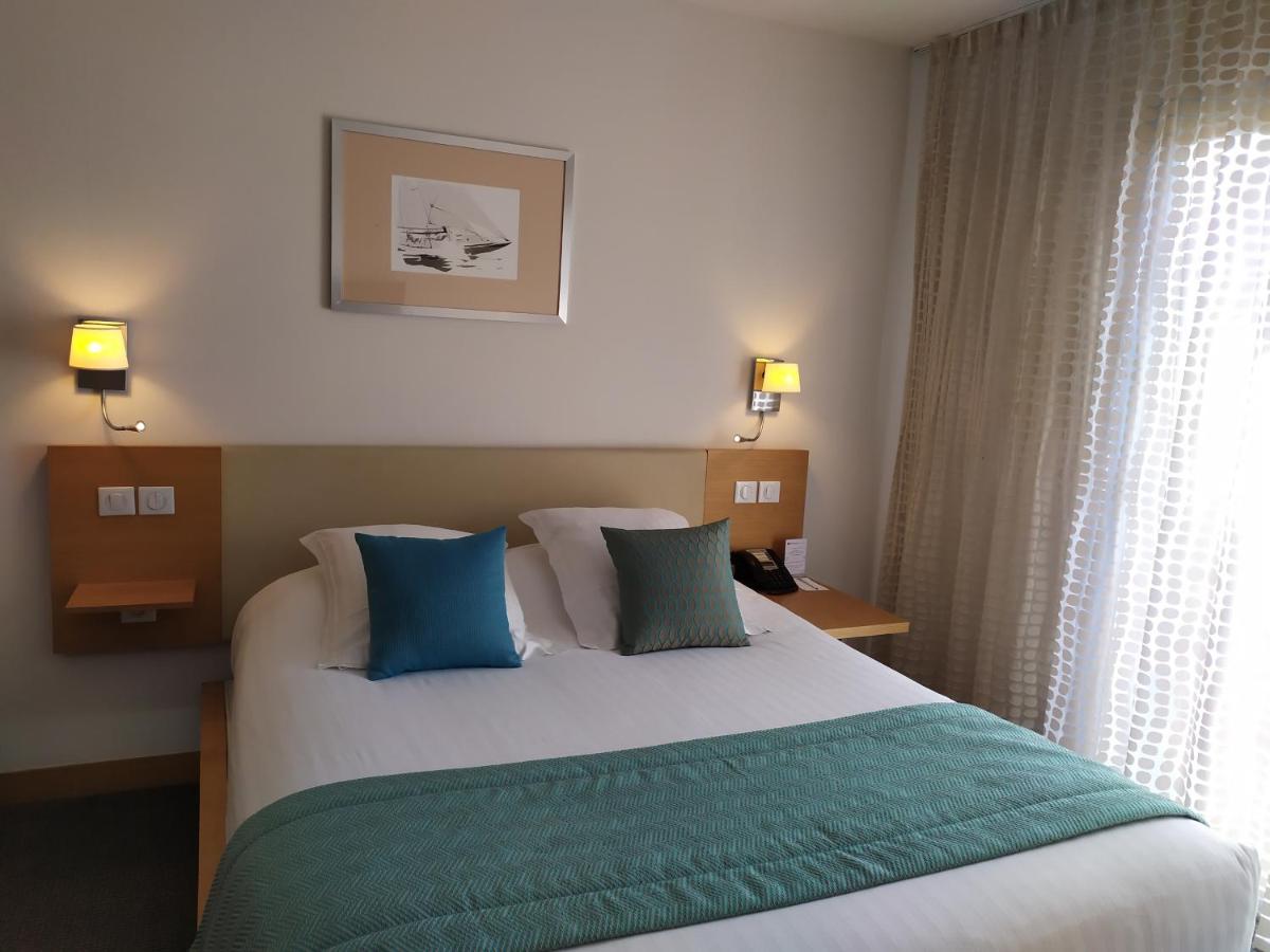 Un ou plusieurs lits dans un hébergement de l'établissement Best Western Premier Hôtel du Vieux-Port