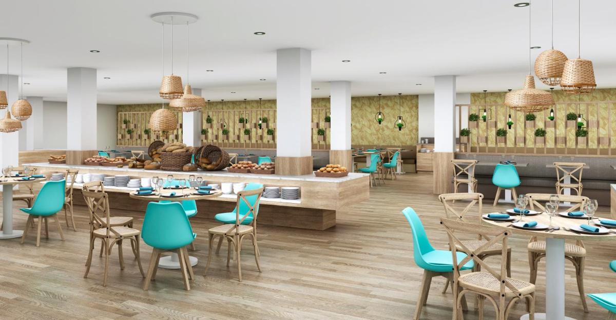 Un restaurante o sitio para comer en Gara Suites Golf & Spa