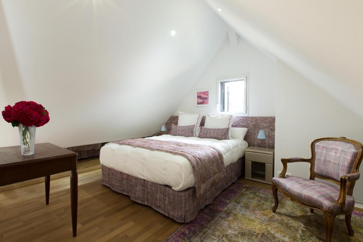 Un ou plusieurs lits dans un hébergement de l'établissement Hôtel Le Cep & Spa