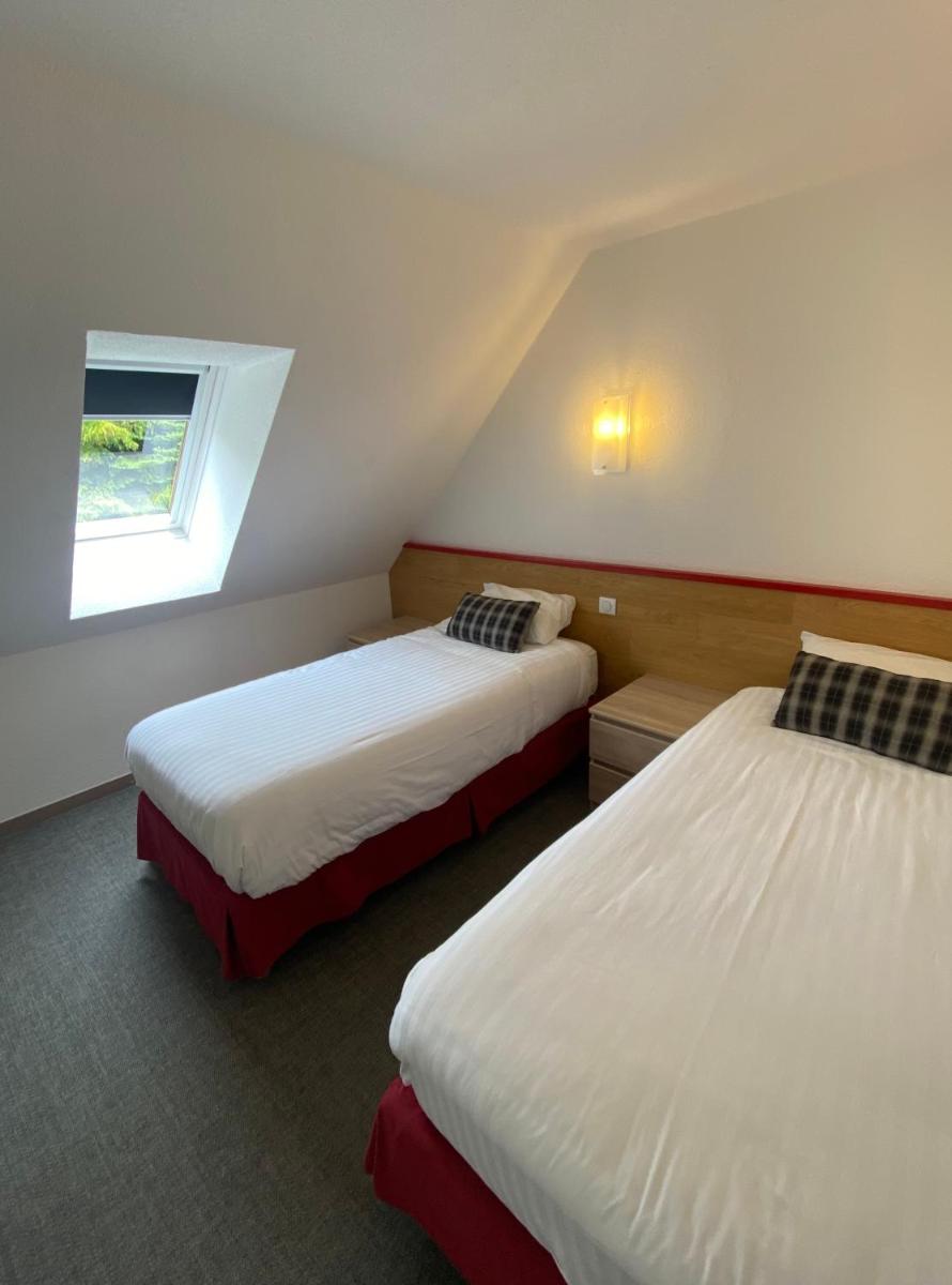 Un ou plusieurs lits dans un hébergement de l'établissement Sancy Resort