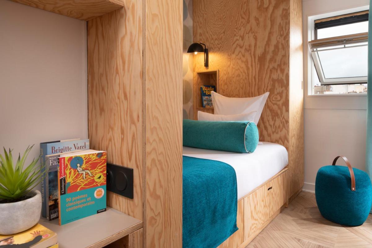 Un ou plusieurs lits dans un hébergement de l'établissement Hotel Locomo - Gare de Lyon Bastille
