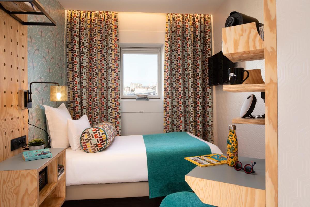 Un ou plusieurs lits dans un hébergement de l'établissement Hotel Locomo - Gare de Lyon Bastille