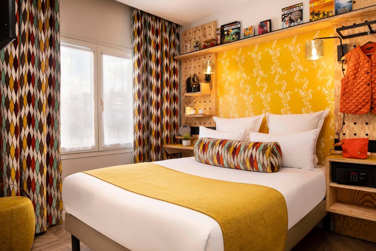 Un ou plusieurs lits dans un hébergement de l'établissement Hotel Locomo - Gare de Lyon Bastille