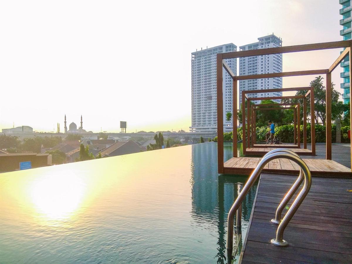 Simple Studio Apartment at Grand Kamala Lagoon By Travelio - Housity