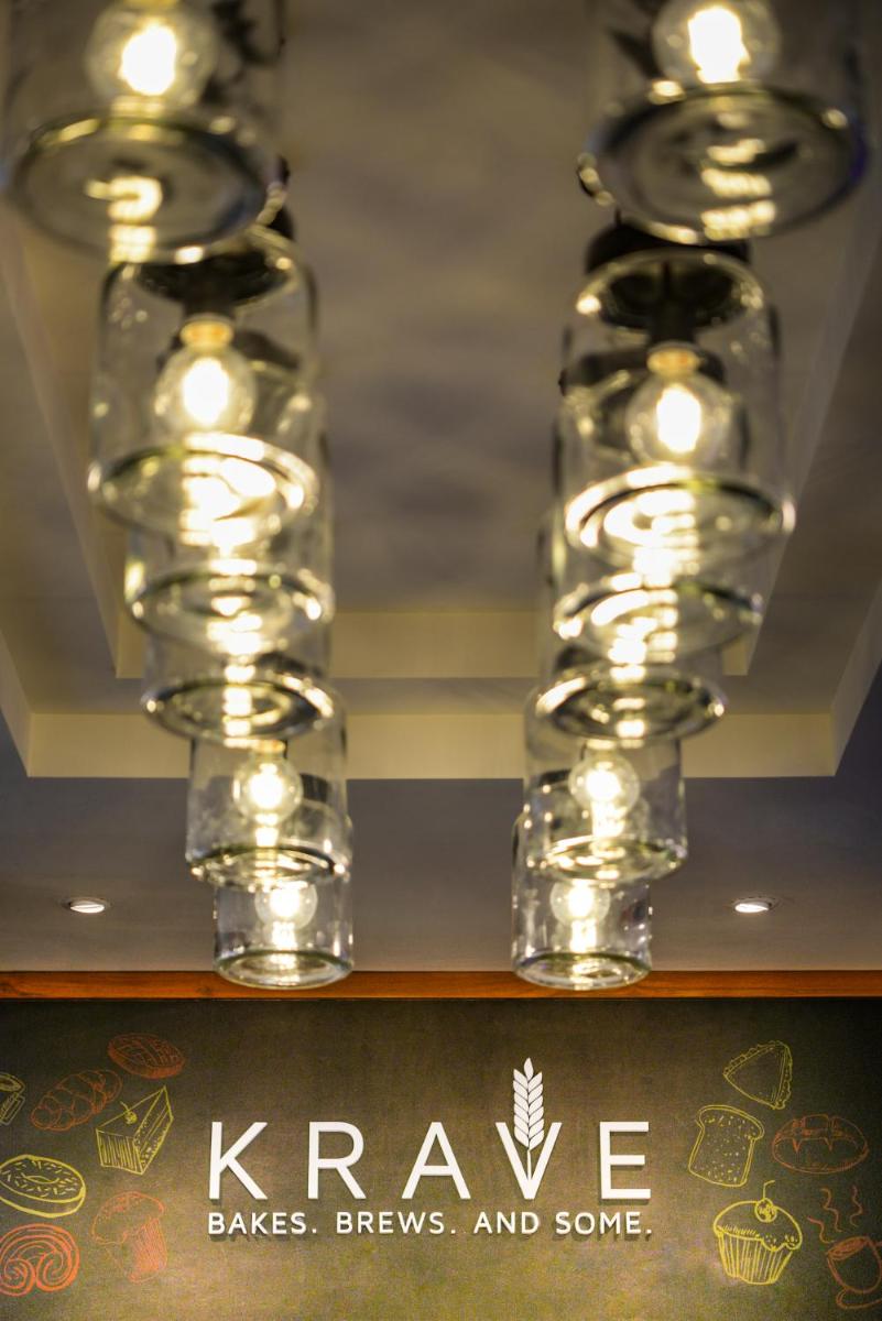 a shelf with three lights on top of a shelf at The Residency Towers Puducherry in Puducherry