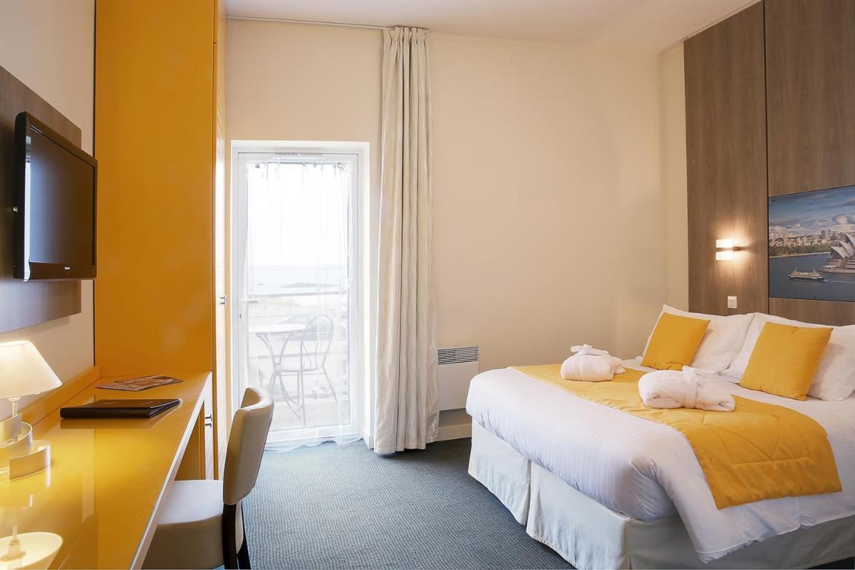 Un ou plusieurs lits dans un hébergement de l'établissement Best Western Plus Les Terrasses de Bréhat