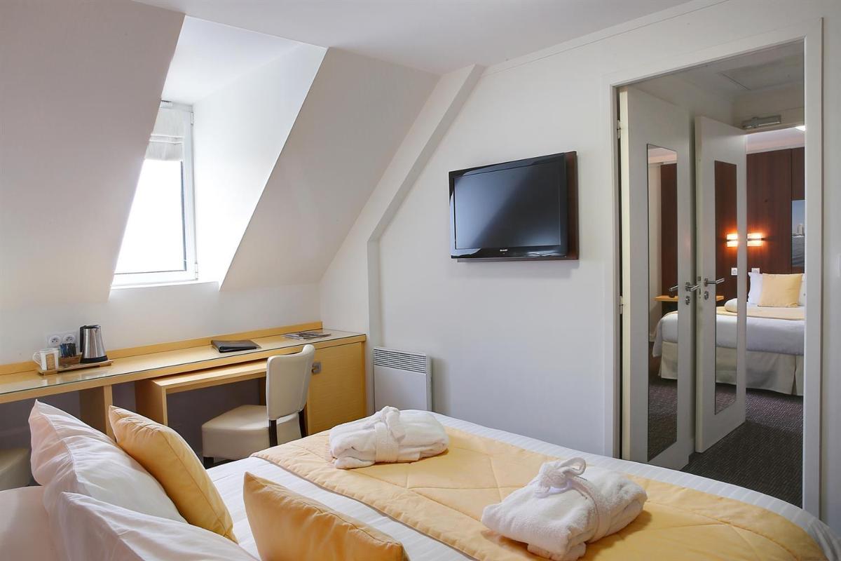 Un ou plusieurs lits dans un hébergement de l'établissement Best Western Plus Les Terrasses de Bréhat