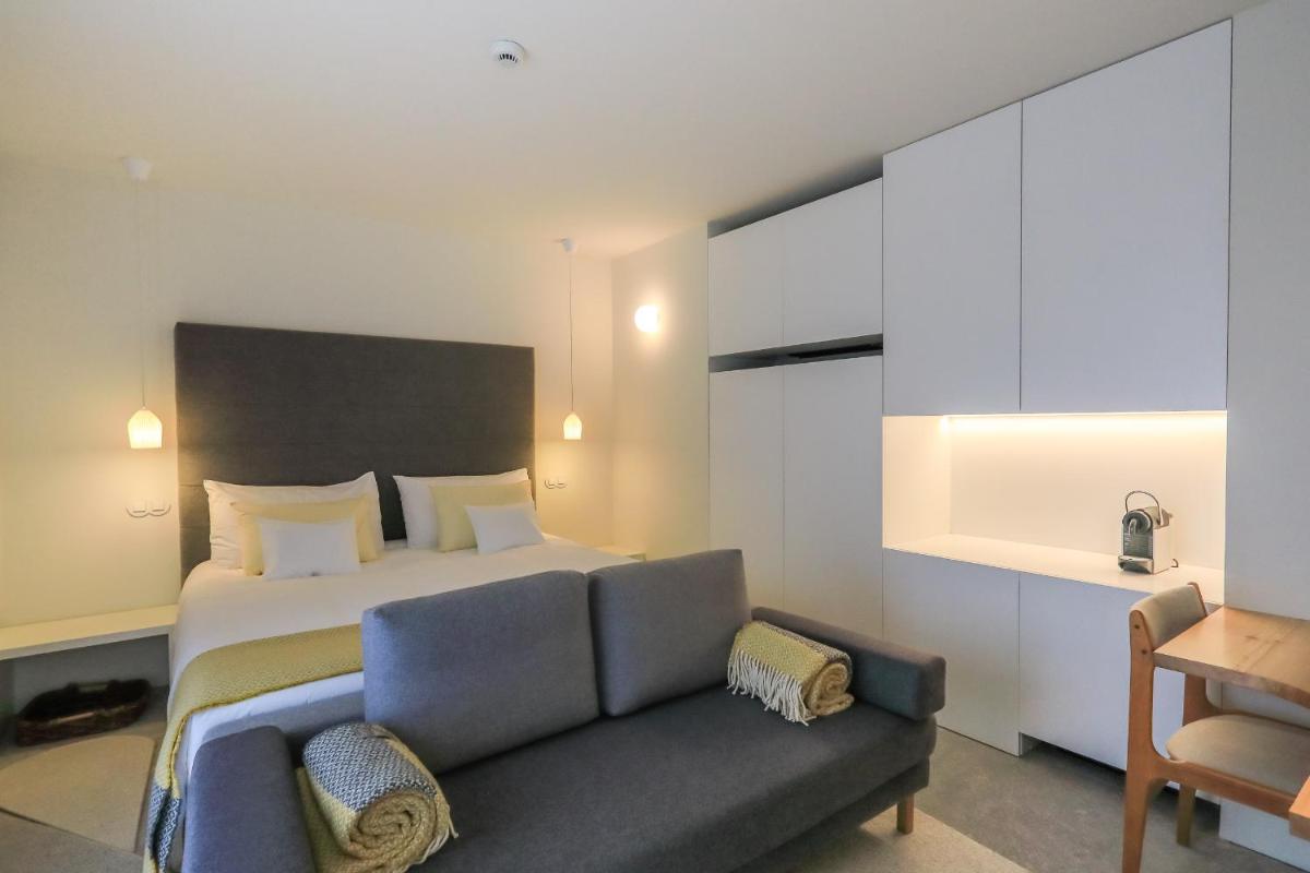 Uma cama ou camas num quarto em Casas Da Lapa, Nature & Spa Hotel