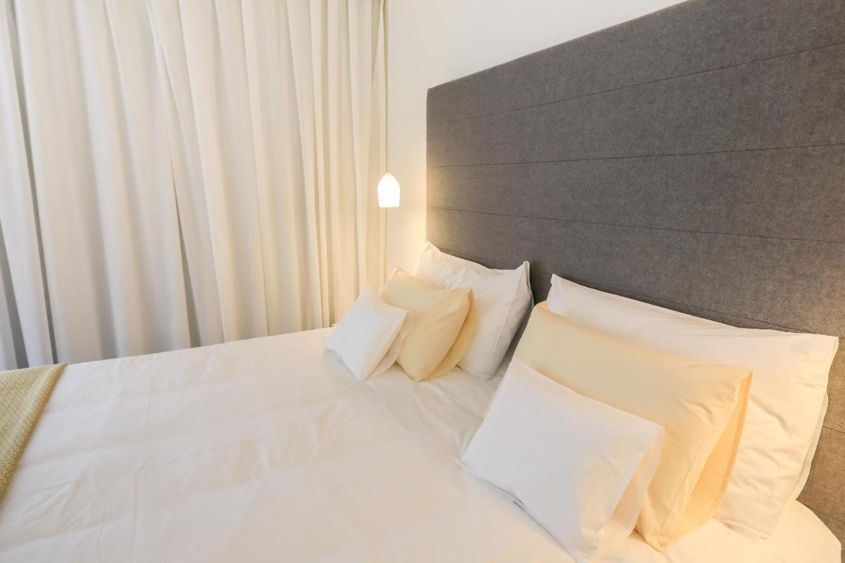 Uma cama ou camas num quarto em Casas Da Lapa, Nature & Spa Hotel