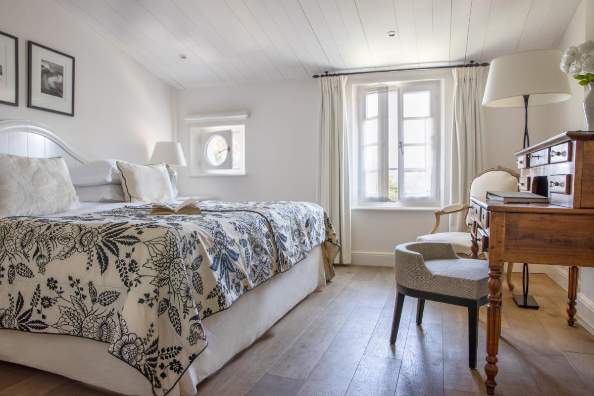 Un ou plusieurs lits dans un hébergement de l'établissement Villa Clarisse & Spa by Olivier Claire
