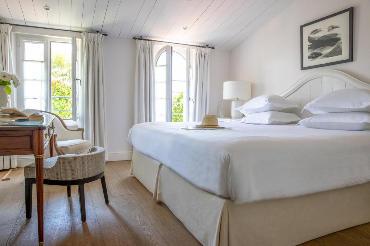 Un ou plusieurs lits dans un hébergement de l'établissement Villa Clarisse & Spa by Olivier Claire