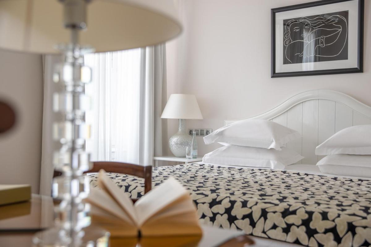 Un ou plusieurs lits dans un hébergement de l'établissement Villa Clarisse & Spa by Olivier Claire