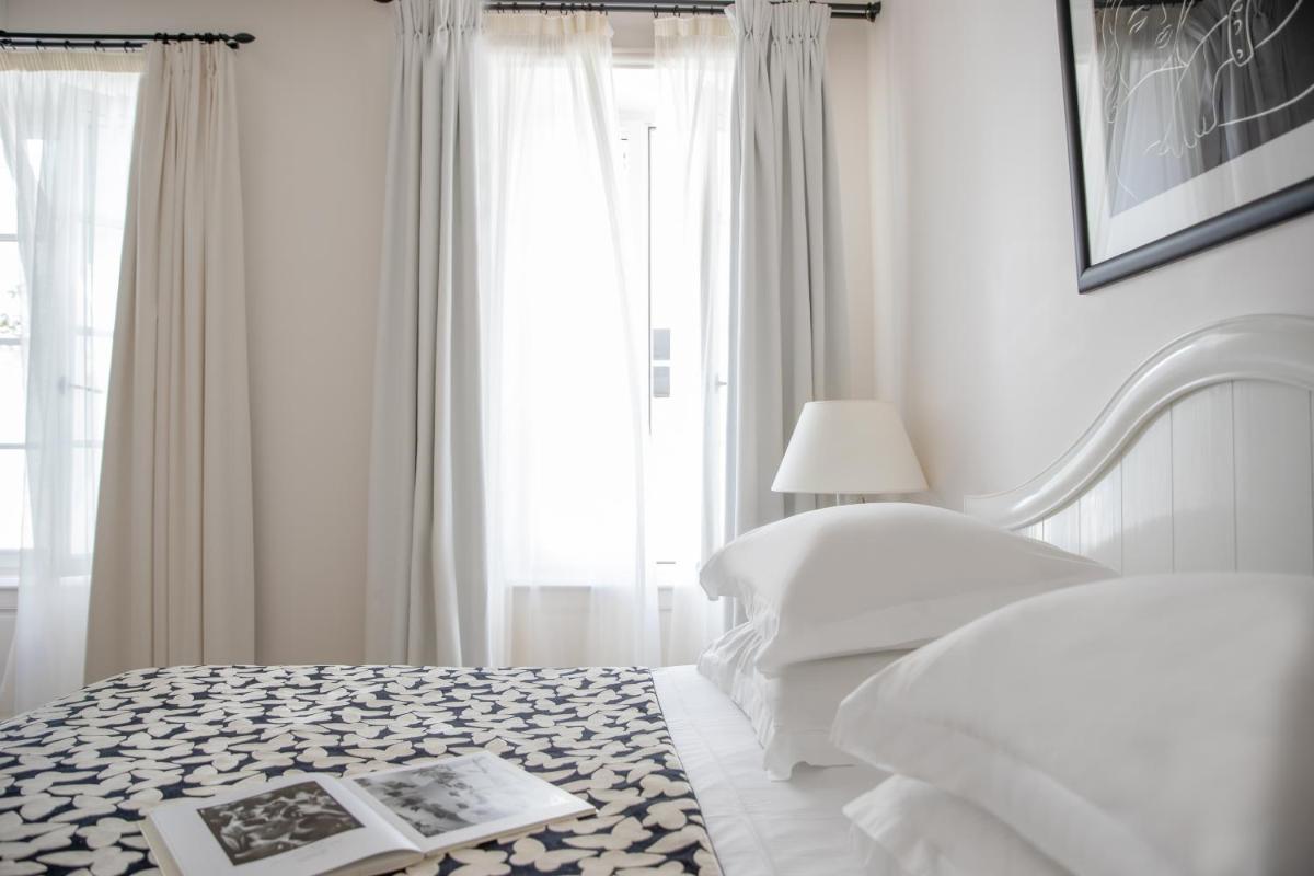 Un ou plusieurs lits dans un hébergement de l'établissement Villa Clarisse & Spa by Olivier Claire