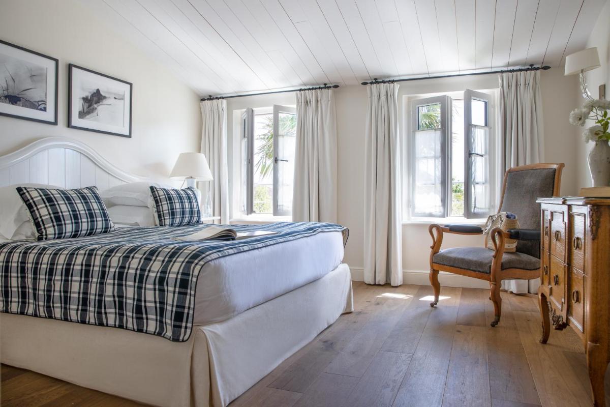 Un ou plusieurs lits dans un hébergement de l'établissement Villa Clarisse & Spa by Olivier Claire