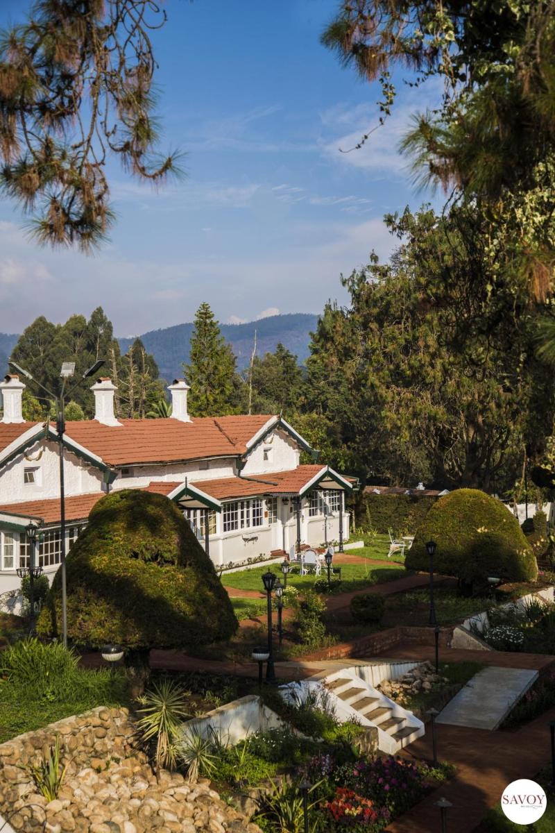 a building with a garden in front of it at Savoy - IHCL SeleQtions in Ooty