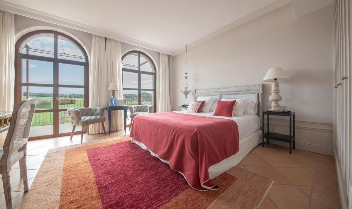 Cama o camas de una habitación en Casa Anamaria Hotel