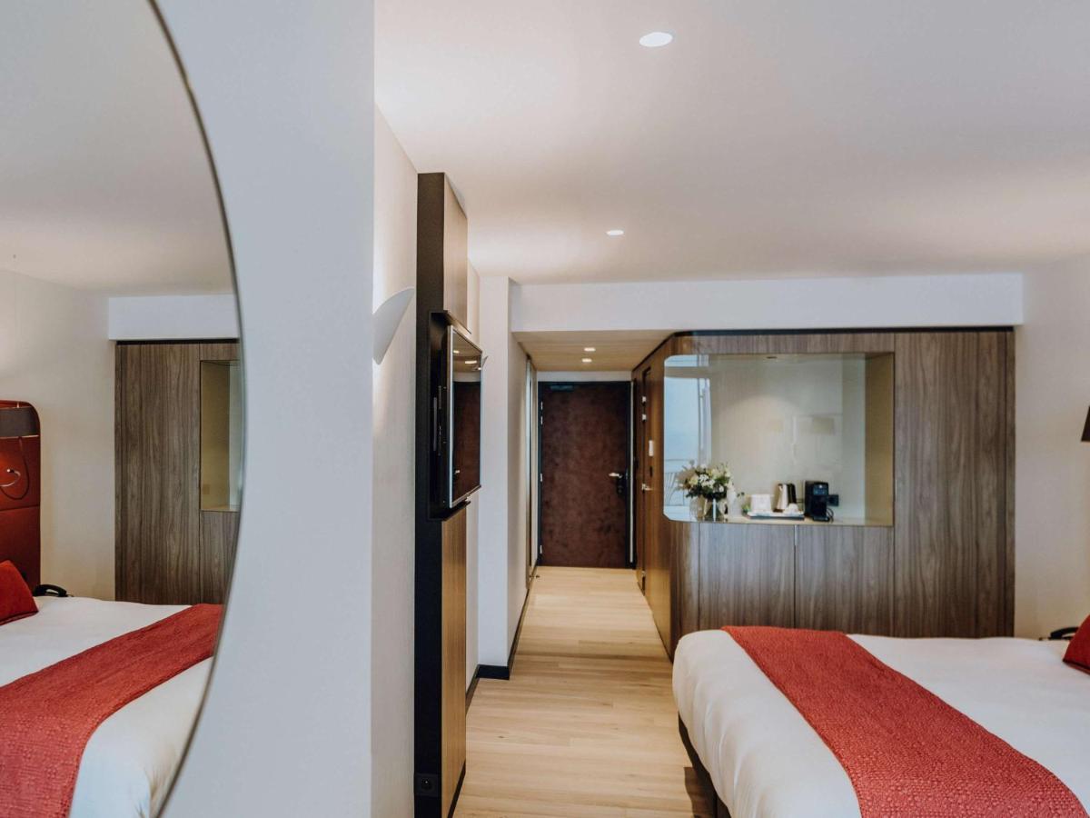 Un ou plusieurs lits dans un hébergement de l'établissement Sainte-Barbe Hotel & Spa Le Conquet - MGallery Collection