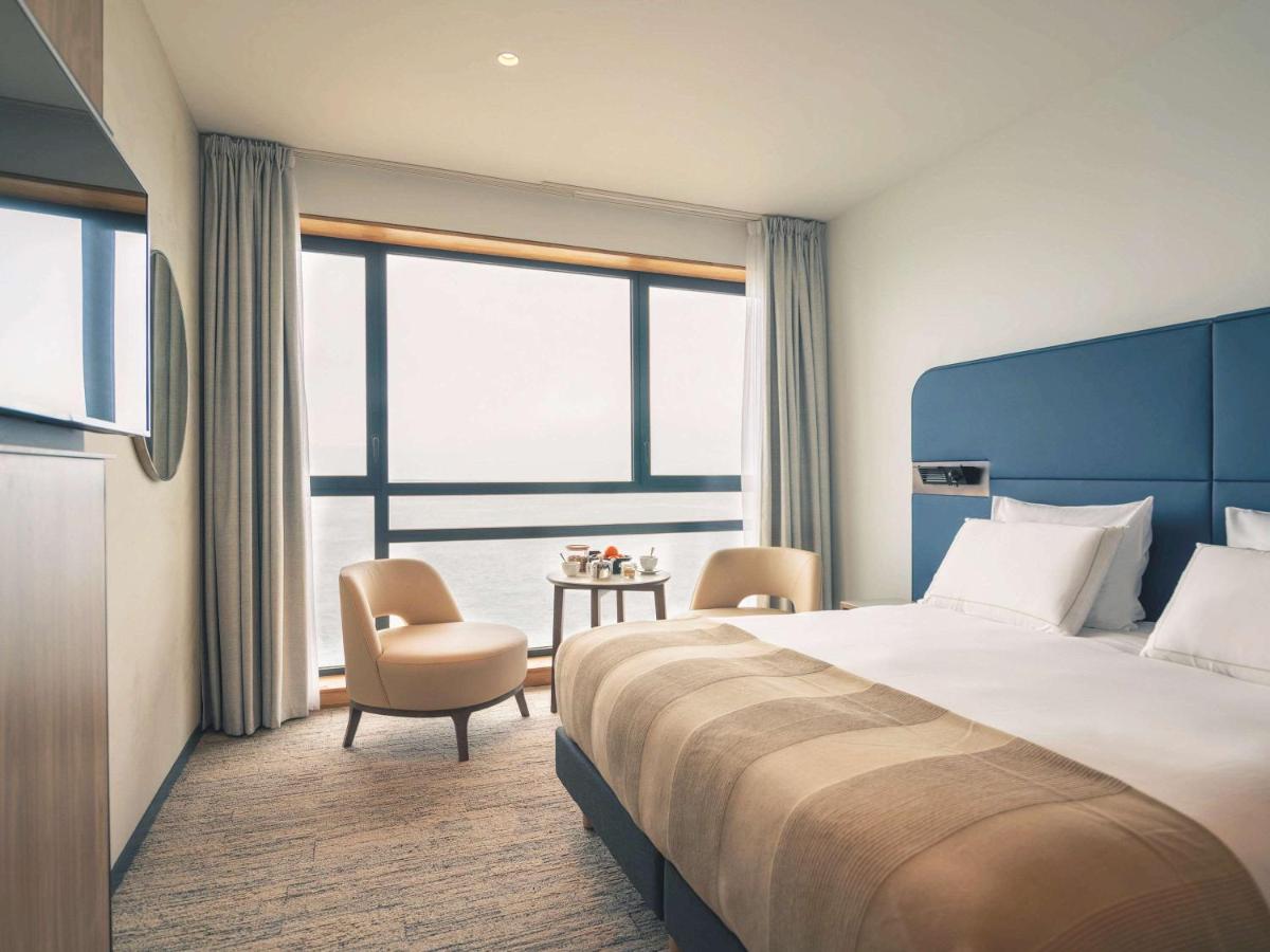 Un ou plusieurs lits dans un hébergement de l'établissement Sainte-Barbe Hotel & Spa Le Conquet - MGallery Collection