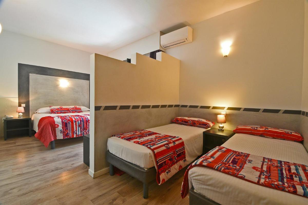 Un ou plusieurs lits dans un hébergement de l'établissement Golfe Hôtel & Spa Porto-Vecchio