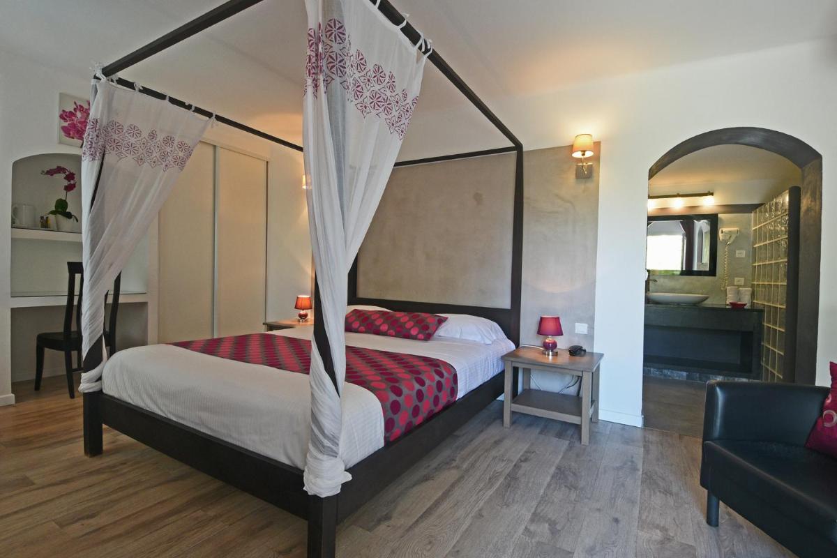 Un ou plusieurs lits dans un hébergement de l'établissement Golfe Hôtel & Spa Porto-Vecchio