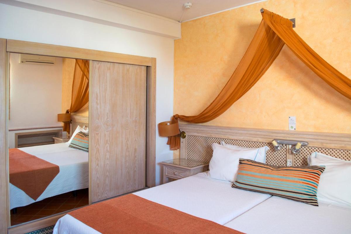 Uma cama ou camas num quarto em Hotel do Cerro