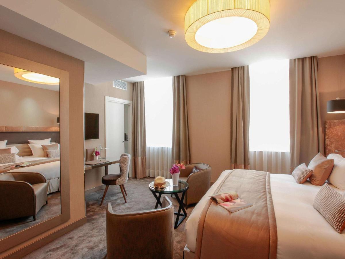 Un ou plusieurs lits dans un hébergement de l'établissement La Cour des Consuls Hotel & Spa Toulouse - MGallery Collection