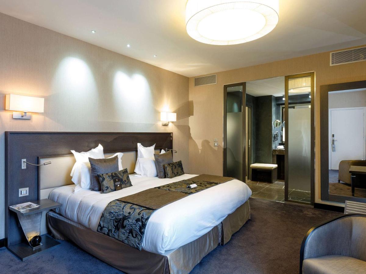 Un ou plusieurs lits dans un hébergement de l'établissement La Cour des Consuls Hotel & Spa Toulouse - MGallery Collection