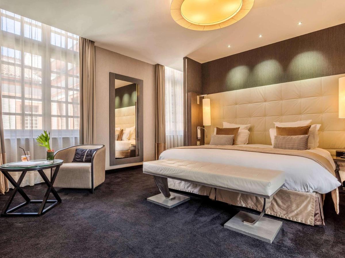 Un ou plusieurs lits dans un hébergement de l'établissement La Cour des Consuls Hotel & Spa Toulouse - MGallery Collection