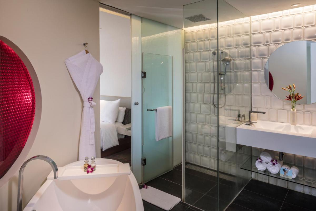 a bathroom with a shower and a toilet and a sink at The Park Hyderabad, Banjara Hills near Hussain Sagar Lake in Hyderabad a bathroom with a shower and a toilet and a sink at The Park Hyderabad, Banjara Hills near Hussain Sagar Lake in Hyderabad