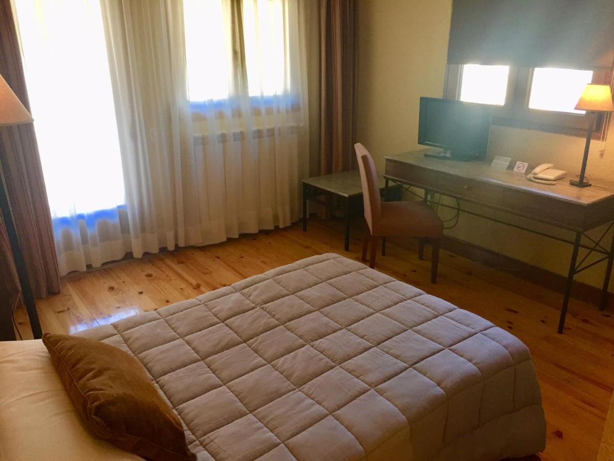 Cama o camas de una habitación en Hotel Rural Spa & Wellness Hacienda Los Robles