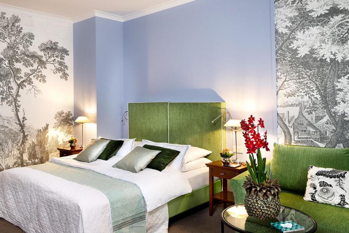 Ein Bett oder Betten in einem Zimmer der Unterkunft Hotel Goliath am Dom