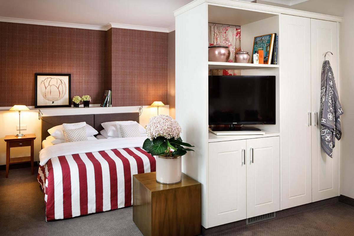 Ein Bett oder Betten in einem Zimmer der Unterkunft Hotel Goliath am Dom