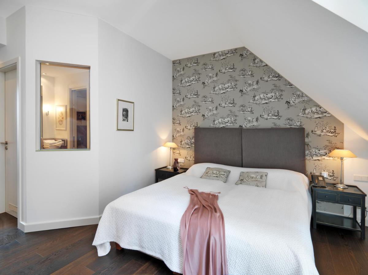 Ein Bett oder Betten in einem Zimmer der Unterkunft Hotel Goliath am Dom