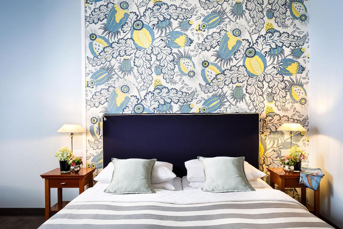 Ein Bett oder Betten in einem Zimmer der Unterkunft Hotel Goliath am Dom