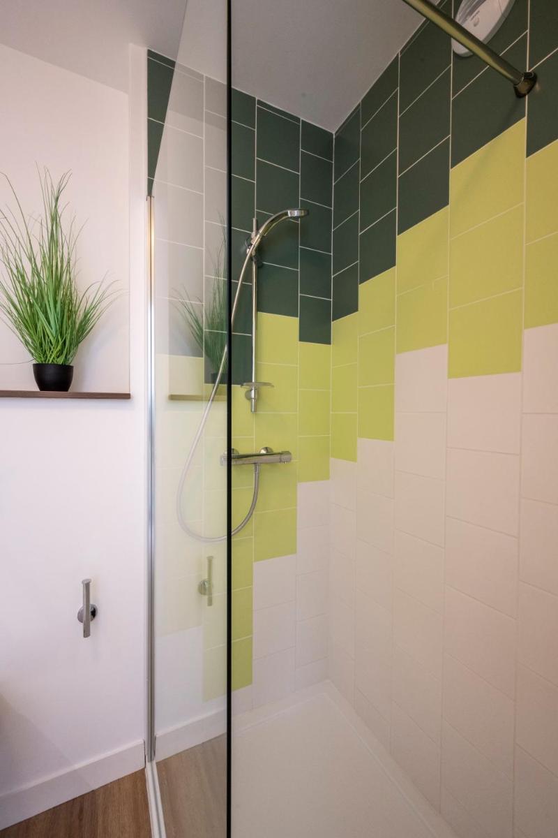 Salle de bains dans l'établissement ATHOME RESIDENCE ET SPA