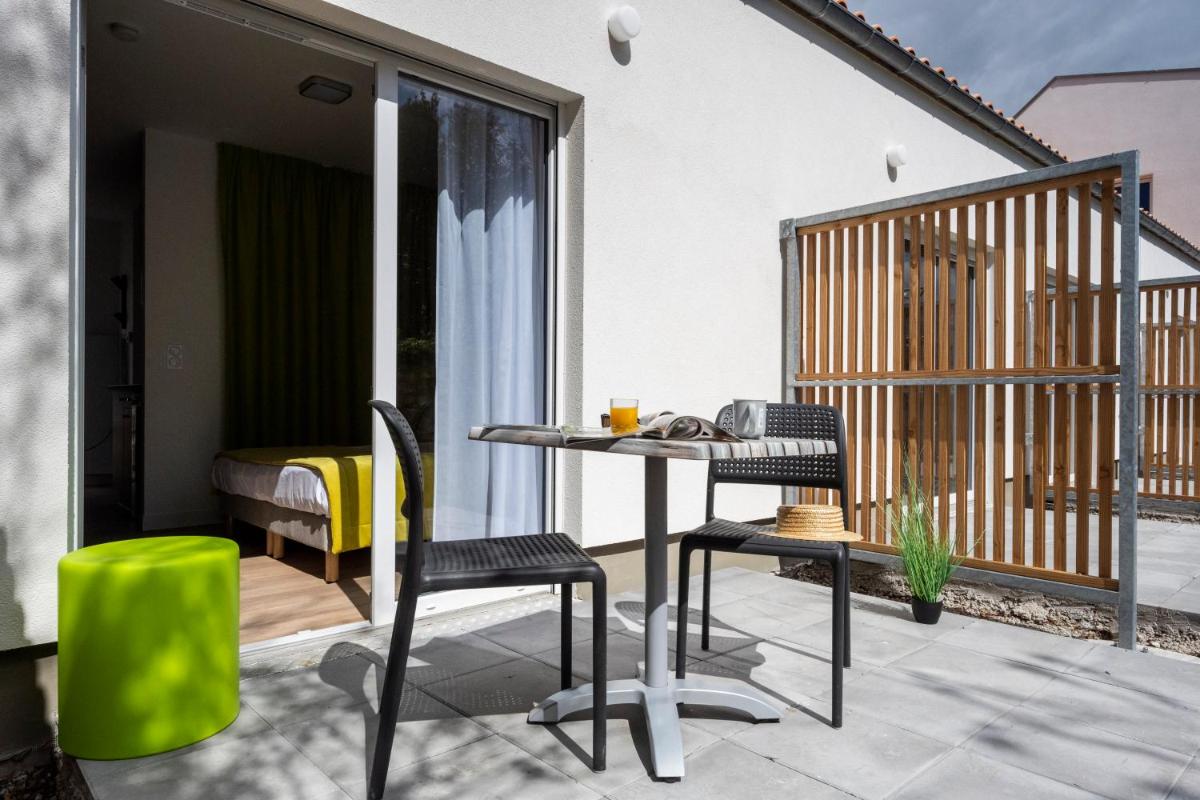 Balcon ou terrasse dans l'établissement ATHOME RESIDENCE ET SPA