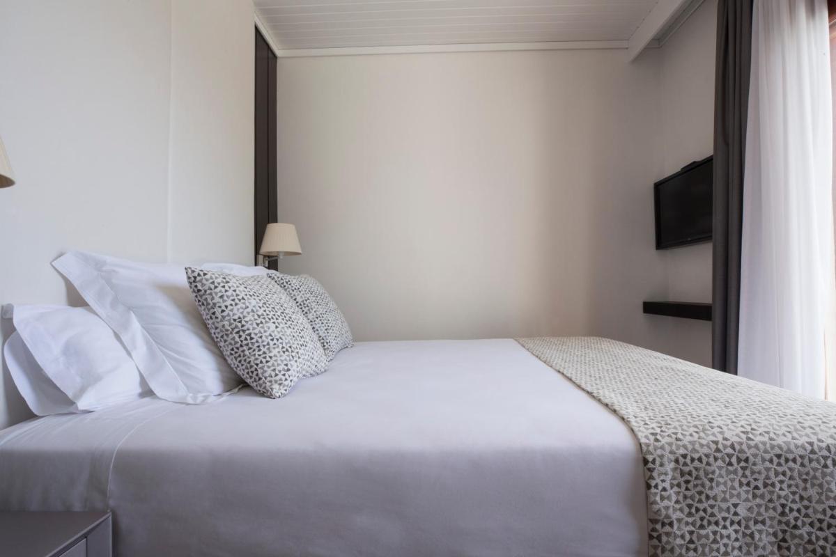 Cama o camas de una habitación en Hotel Santa Marta