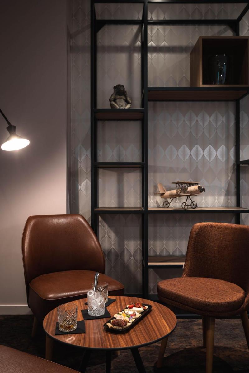 Coin salon dans l'établissement Mercure Aix-les-Bains Domaine de Marlioz Hôtel & Spa