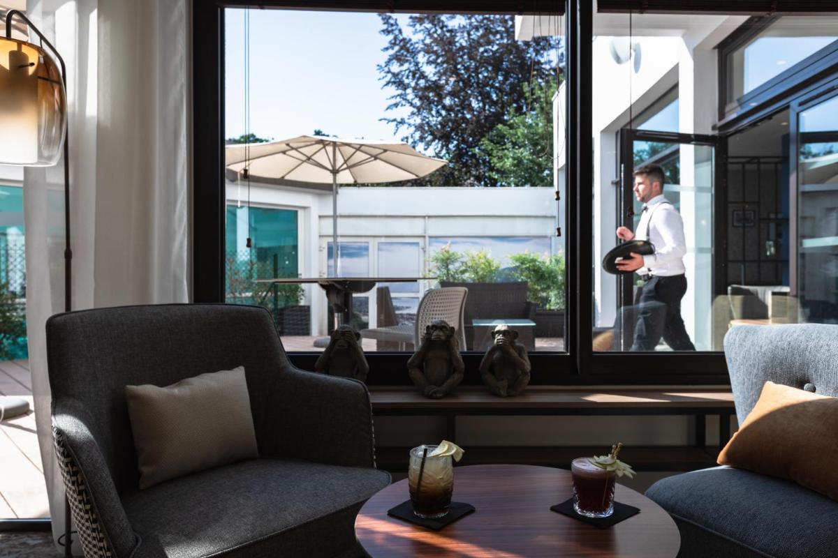 Coin salon dans l'établissement Mercure Aix-les-Bains Domaine de Marlioz Hôtel & Spa