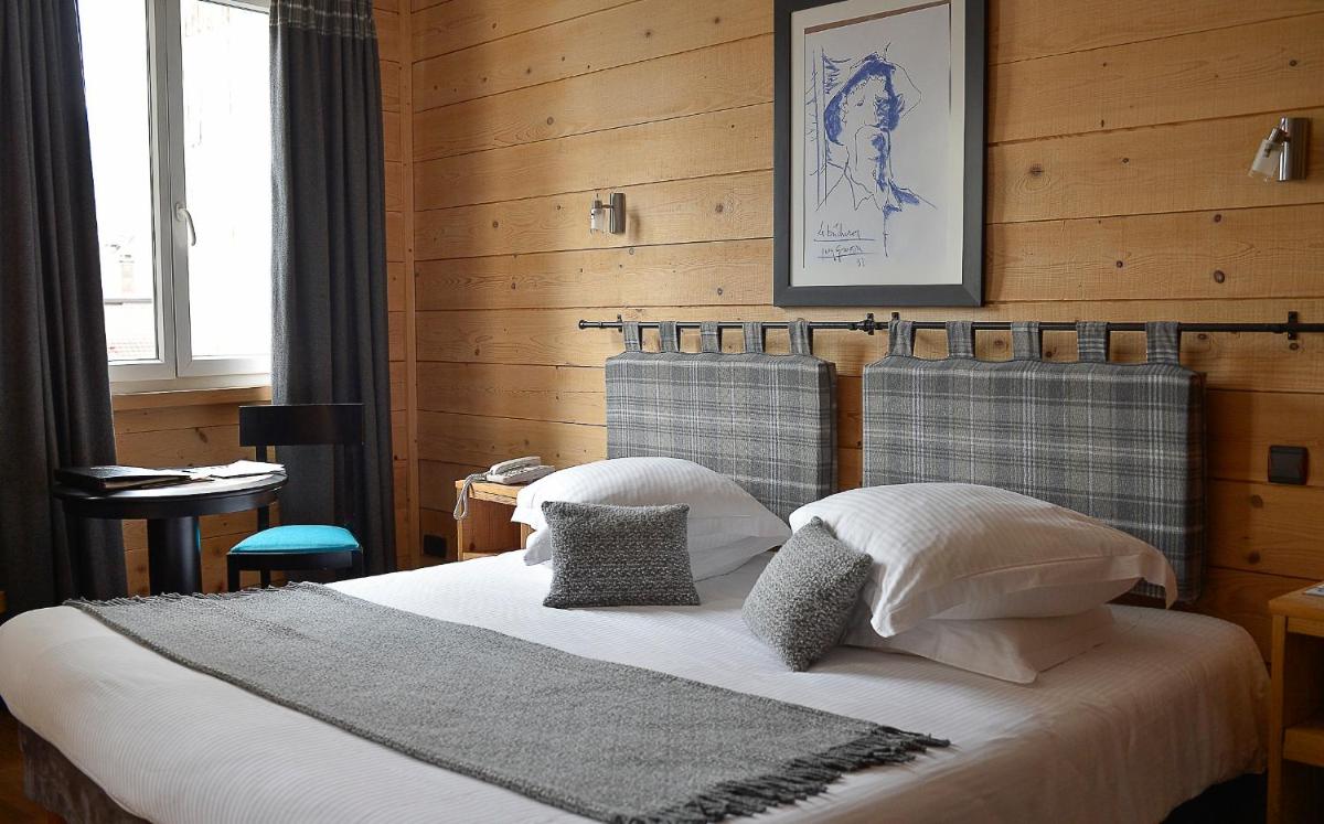 Un ou plusieurs lits dans un hébergement de l'établissement Le Grand Hotel & Spa