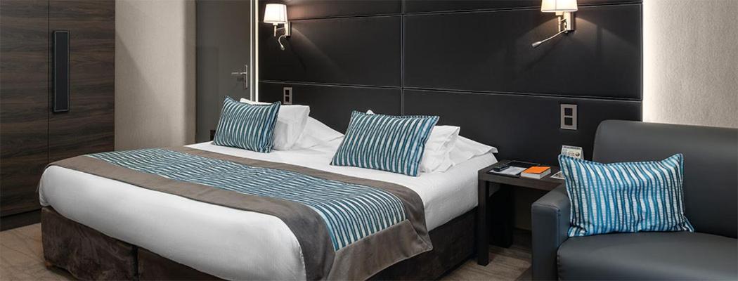 Un ou plusieurs lits dans un hébergement de l'établissement Le Grand Hotel & Spa