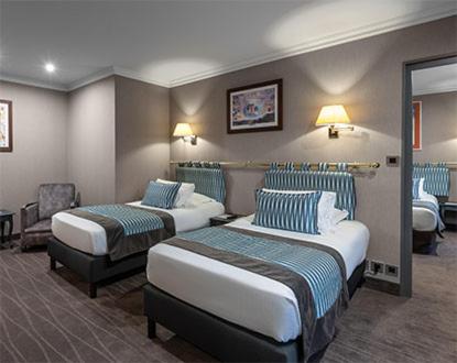 Un ou plusieurs lits dans un hébergement de l'établissement Le Grand Hotel & Spa