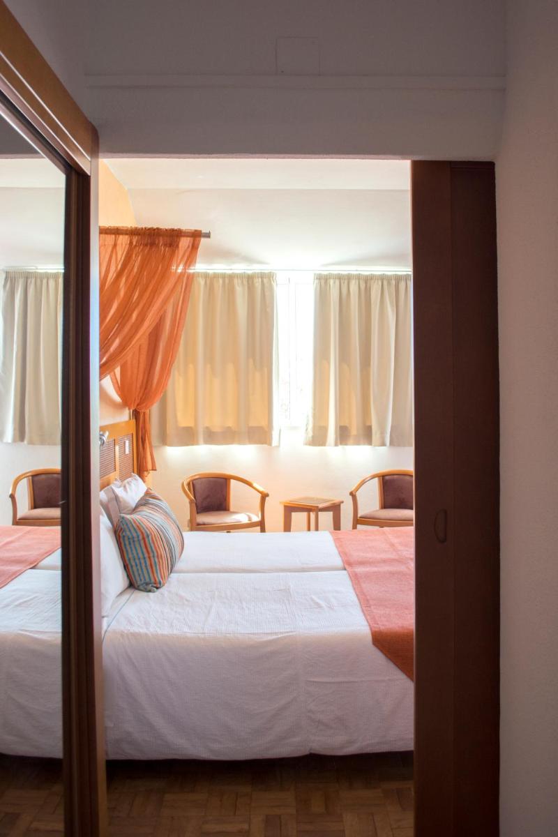 Uma cama ou camas num quarto em Hotel do Cerro