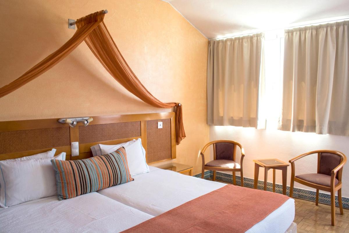 Uma cama ou camas num quarto em Hotel do Cerro