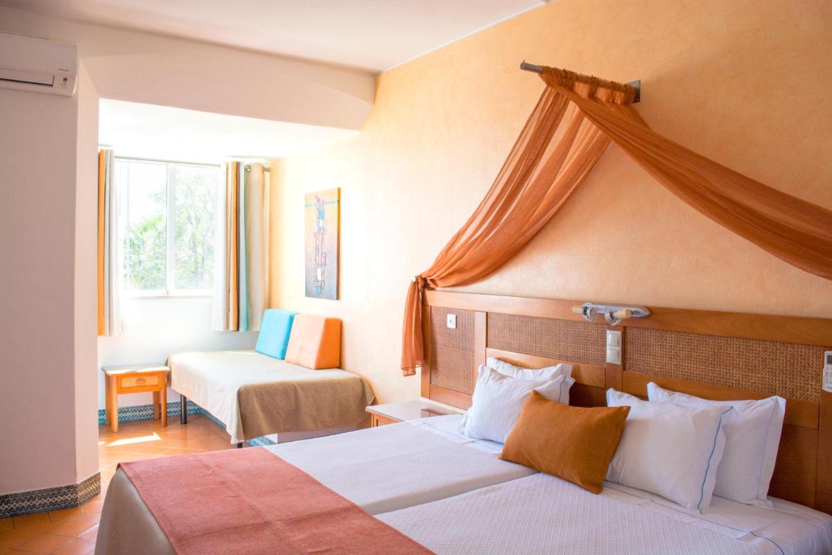 Uma cama ou camas num quarto em Hotel do Cerro