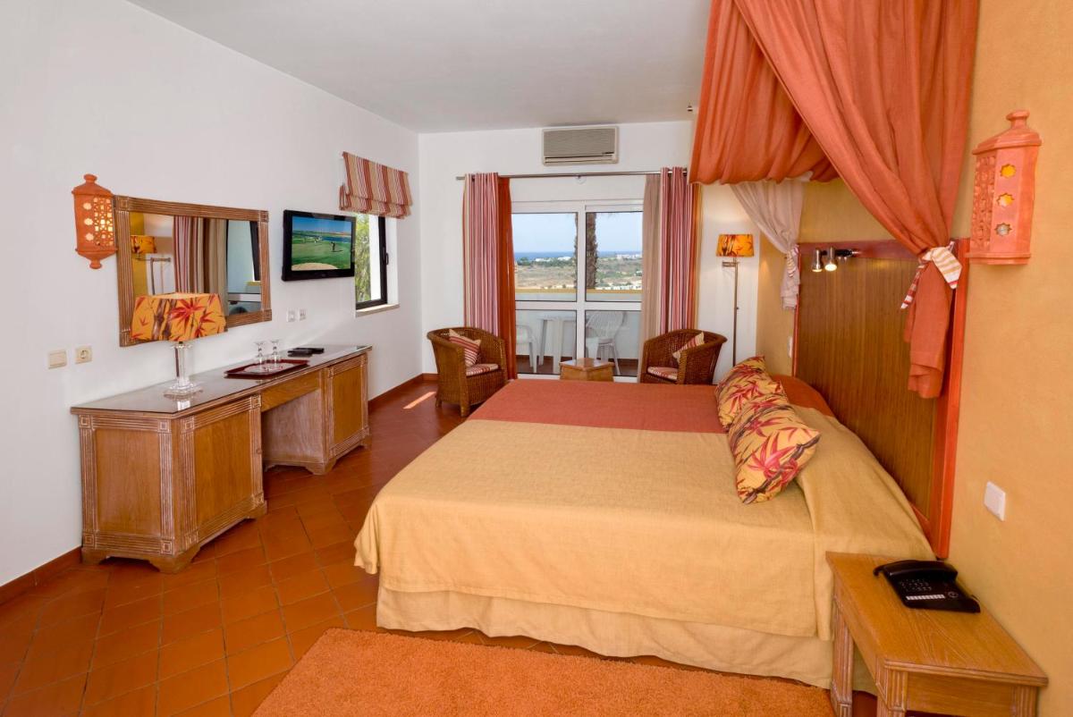 Uma cama ou camas num quarto em Cerro Da Marina Hotel - Adults Only
