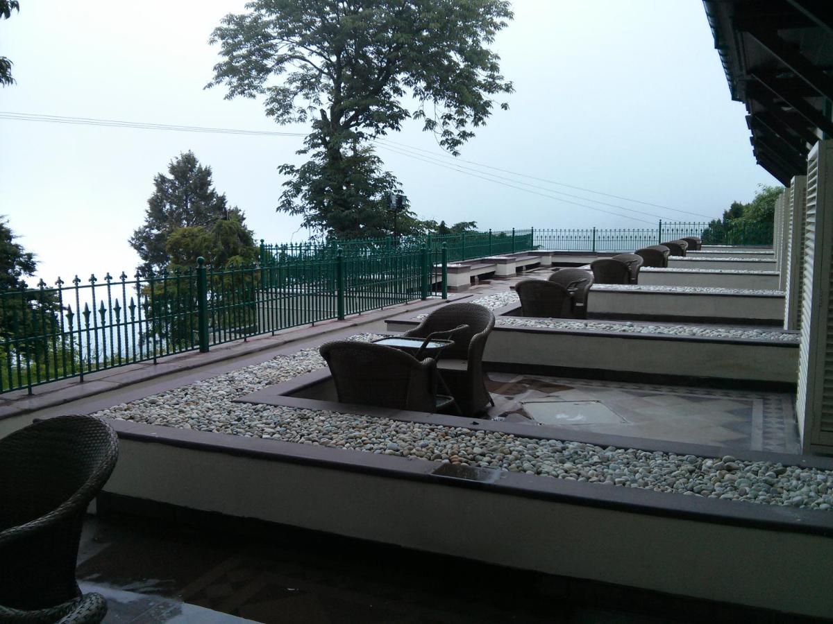 a row of chairs sitting on a set of stairs at Welcomhotel by ITC Hotels, The Savoy, Mussoorie in Mussoorie